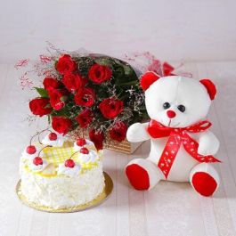Eggless Pineapple Cake Half Kg with 6 Red Roses Bunch and a Teddy Bear