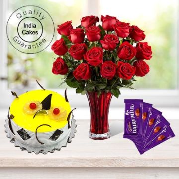 Eggless Pineapple Cake 1.5 Kg with 6 Red Roses Bunch and 5 Chocolates