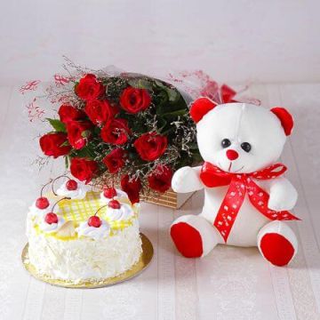 Eggless Pineapple Cake Half Kg with 6 Red Roses Bunch and a Teddy Bear