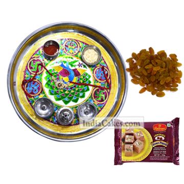 Golden Thali With Green Design And Soanpapdi And Raisins