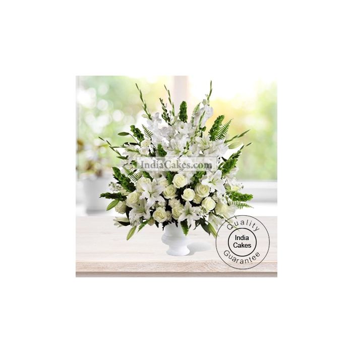 ARRANGEMENT OF LILIES, ANTHURIUMS, ORCHIDS, ROSES AND CARNATIONS ( ALL WHITE FLOWERS )