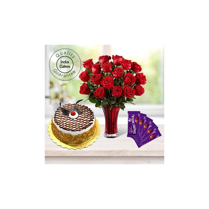 Eggless Butterscotch Cake 1.5 Kg with 6 Red Roses Bunch and 5 Chocolates Eggless Butterscotch Cake 1.5 Kg with 6 Red Roses Bunch and 5 Chocolates