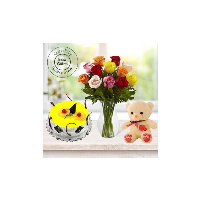 Eggless Pineapple Cake 1 Kg with 6 Mix Roses Bunch and a Teddy Bear Eggless Pineapple Cake 1 Kg with 6 Mix Roses Bunch and a Teddy Bear
