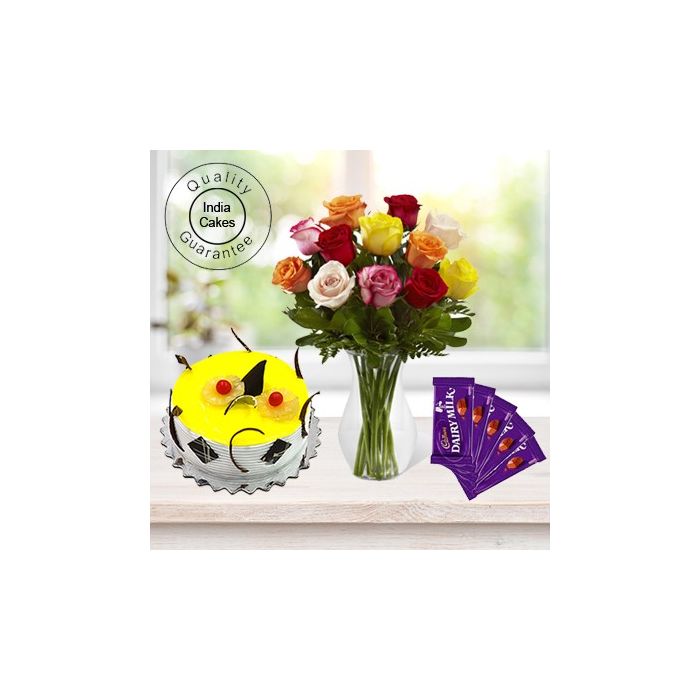 Eggless Pineapple Cake 1.5 Kg with 6 Mix Roses Bunch and 5 Chocolates Eggless Pineapple Cake 1.5 Kg with 6 Mix Roses Bunch and 5 Chocolates