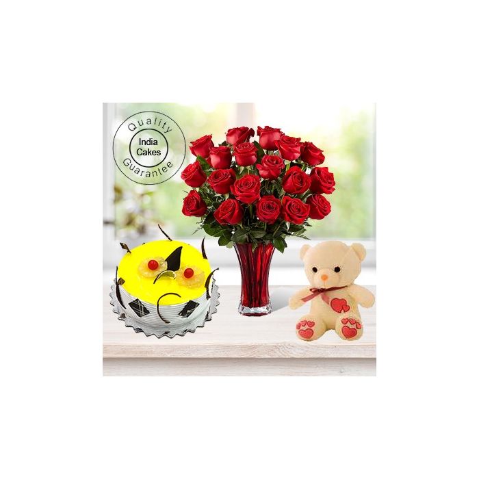 Eggless Pineapple Cake 1.5 Kg with 6 Red Roses Bunch and a Teddy Bear Eggless Pineapple Cake 1.5 Kg with 6 Red Roses Bunch and a Teddy Bear