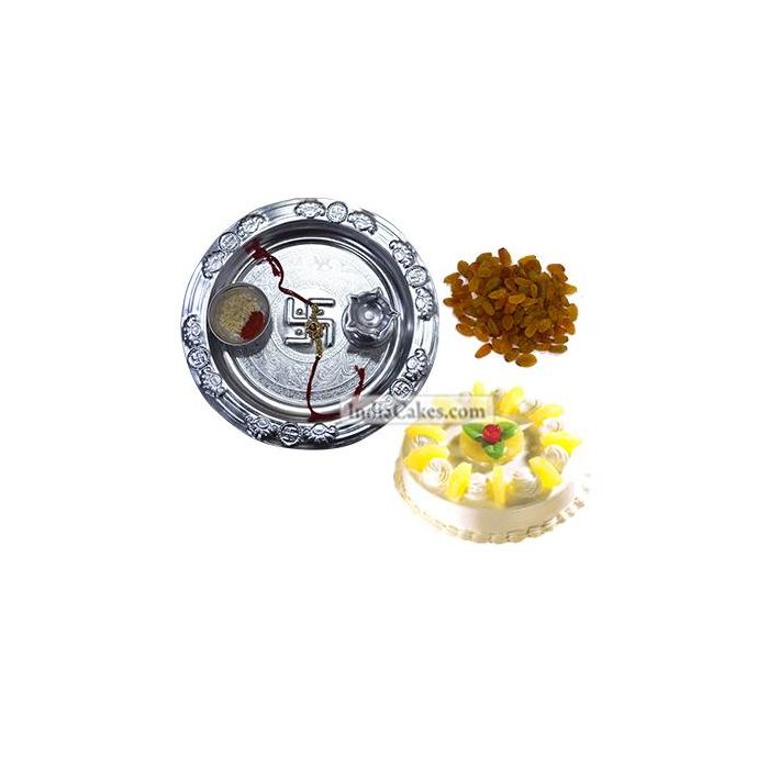 Silver Thali And Half Kg Eggless Pineapple Cake And 250 gms Raisins Dryfruits Silver Thali And Half Kg Eggless Pineapple Cake And 250 gms Raisins Dryfruits