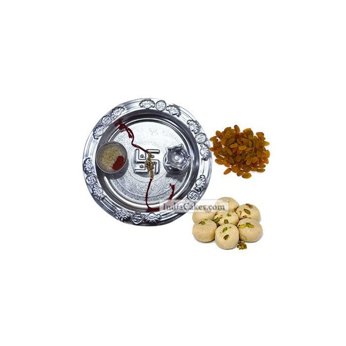 Silver Thali And Pedha With Raisins Dryfruits