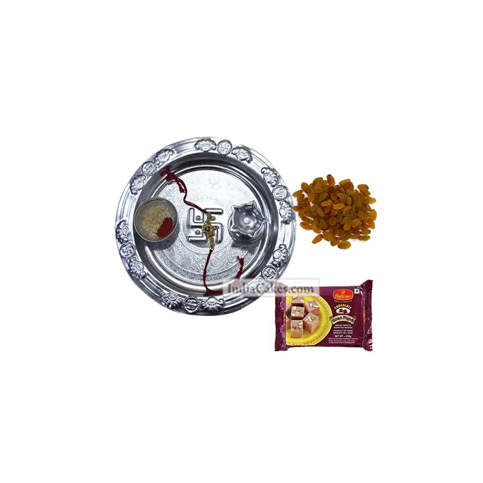Silver Thali With Design And Soanpapdi And Raisins Silver Thali With Design And Soanpapdi And Raisins