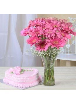 A 1 Kg strawberry cake accompanied by a bunch of fresh pink gerberas. A 1 Kg strawberry cake accompanied by a bunch of fresh pink gerberas.